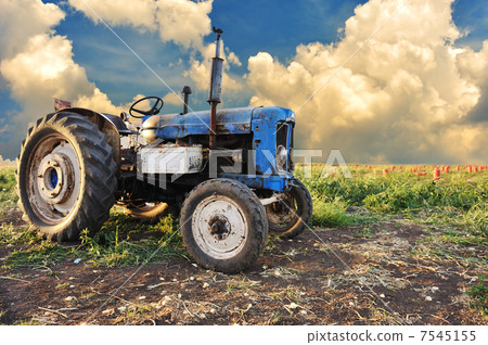 Very old tractor in field, different parts - no trademark at all Very old tractor in field, different parts - no trademark at all 7545155