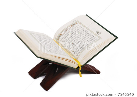 Holy islamic book Koran opened and isolated 7545540
