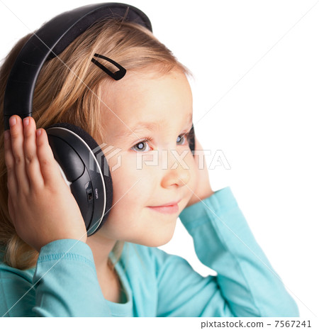 Little girl in headphones Little girl in headphones 7567241