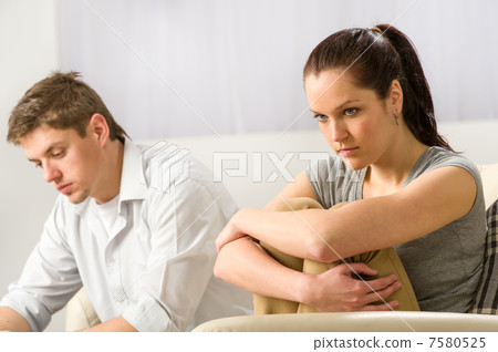Unhappy couple sitting silently after argument Unhappy couple sitting silently after argument 7580525