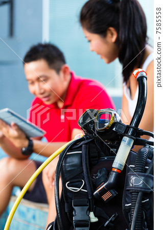 Dive master and student in Asian diving school Dive master and student in Asian diving school 7585558