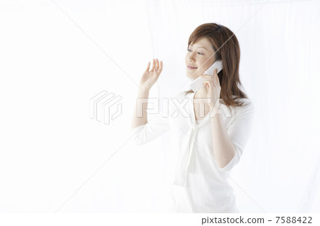 A woman who makes a phone call by cell phone A woman who makes a phone call by cell phone 7588422