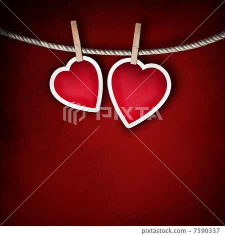 Paper hearts hanging on a rope on grunge background 7590337