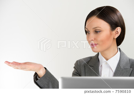 Adult pretty business woman making presentation of new product. Adult pretty business woman making presentation of new product. 7590810