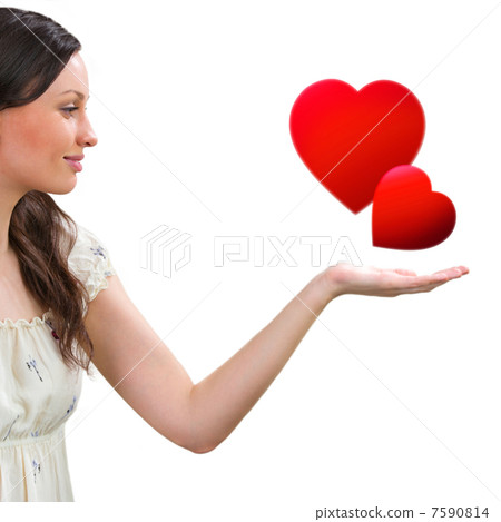 Young smiling woman holding two red hearts against white backgro Young smiling woman holding two red hearts against white backgro 7590814