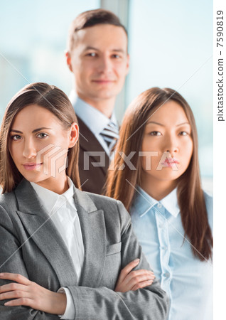Portrait of an attractive young business group standing together Portrait of an attractive young business group standing together 7590819