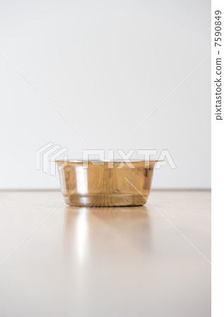 Empty cats steel bowl on wooden floor. Lot of copyspace. Crisis Empty cats steel bowl on wooden floor. Lot of copyspace. Crisis 7590849