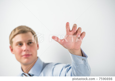 Young positive business man touching virtual button. Editable im Young positive business man touching virtual button. Editable im 7590898