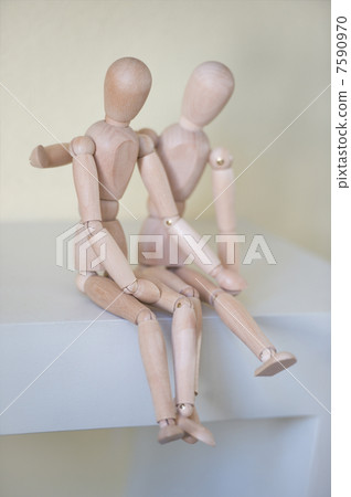 Wooden people sitting at home and hugging. People relationship c Wooden people sitting at home and hugging. People relationship c 7590970