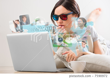 Pretty woman surfing on web with modern laptop 7590972