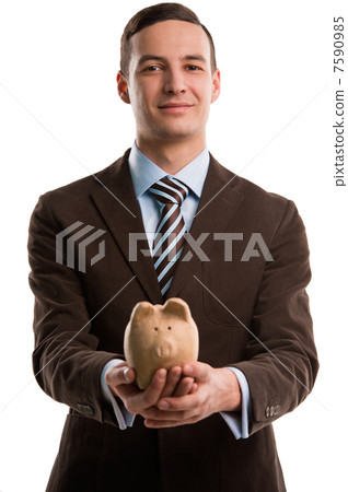 Young happy business man holding piggybank over white background Young happy business man holding piggybank over white background 7590985