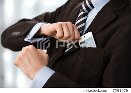 Closeup of torso of confident business man wearing elegant suit Closeup of torso of confident business man wearing elegant suit 7591076