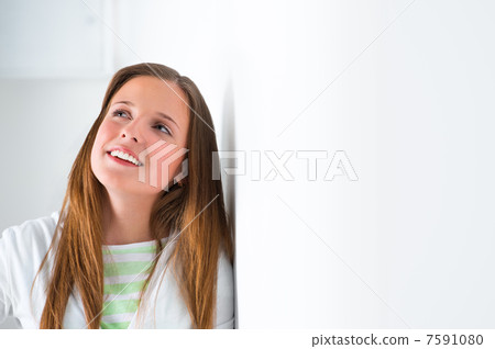 Portrait of a beautiful college student at campus daydreaming Portrait of a beautiful college student at campus daydreaming 7591080