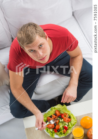 Young handsome man preparing to eat fresh healthy salad sitting Young handsome man preparing to eat fresh healthy salad sitting 7591085