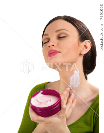 Skin care. Beautiful woman with cream, isolated on white backgro Skin care. Beautiful woman with cream, isolated on white backgro 7591098