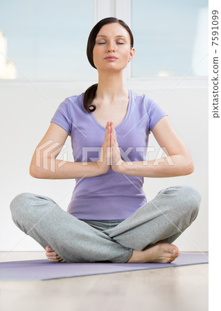 Portrait of beautiful young woman doing yoga exercise - Meditati Portrait of beautiful young woman doing yoga exercise - Meditati 7591099