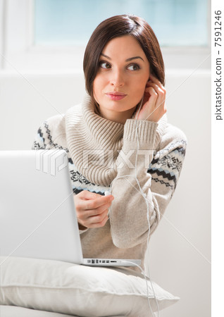 Portrait of a young woman with headphones, lying in front of her Portrait of a young woman with headphones, lying in front of her 7591246