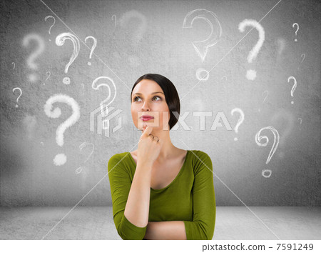 Beautiful woman with questioning expression and question marks a Beautiful woman with questioning expression and question marks a 7591249