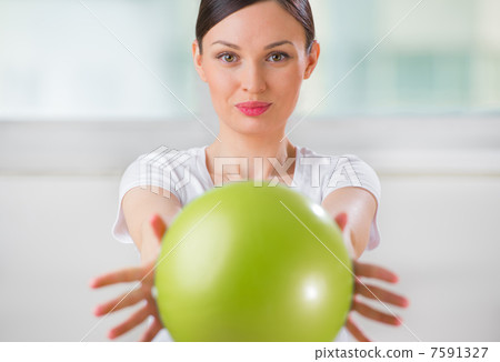 Portrait of fit and healthy woman with toning ball at fitness cl Portrait of fit and healthy woman with toning ball at fitness cl 7591327