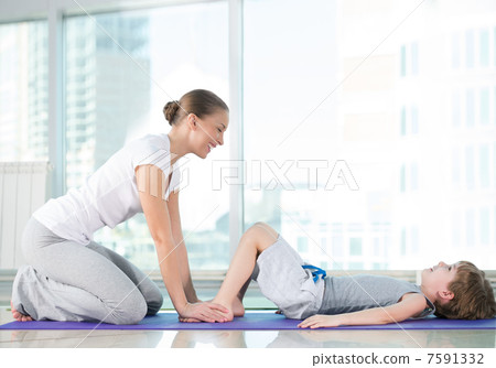Healthy morning stretching - woman with son doing gymnastic exer Healthy morning stretching - woman with son doing gymnastic exer 7591332