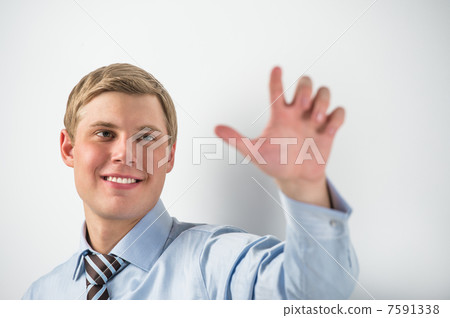 Young positive business man touching virtual button. Editable im Young positive business man touching virtual button. Editable im 7591338