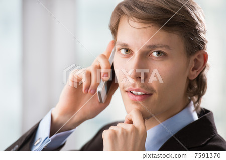 Closeup portrait of handsome business man using cell phone, smil Closeup portrait of handsome business man using cell phone, smil 7591370