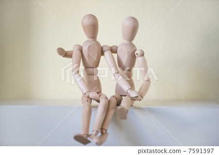 Wooden people sitting at home and hugging. People relationship c Wooden people sitting at home and hugging. People relationship c 7591397