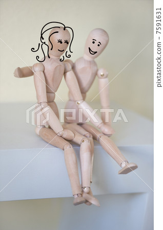 Wooden people sitting at home and hugging. People relationship c Wooden people sitting at home and hugging. People relationship c 7591631