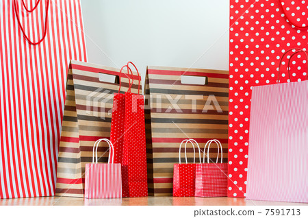 Assorted shopping and gift red paper bags - shopping and holiday Assorted shopping and gift red paper bags - shopping and holiday 7591713