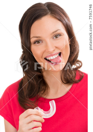 Closeup portrait of charming woman wearing orthodontic braces ho 7591746