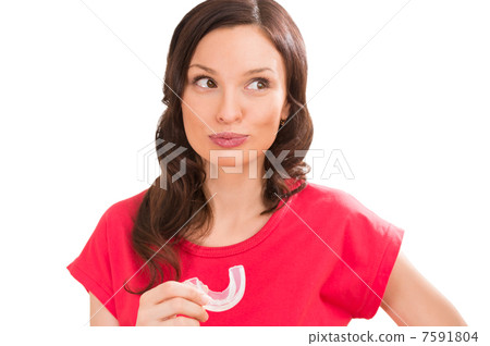 Closeup portrait of charming woman wearing orthodontic braces ho Closeup portrait of charming woman wearing orthodontic braces ho 7591804