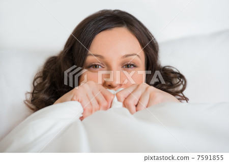 Girl hides her face in bed 7591855