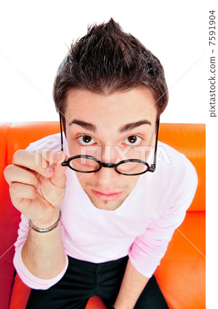 View from above of man in glasses looking at camera with hands o View from above of man in glasses looking at camera with hands o 7591904