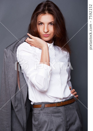 Portrait of a beautiful young business woman standing with hand Portrait of a beautiful young business woman standing with hand 7592152
