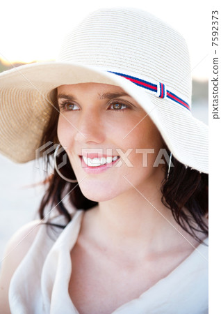 Summer portrait of beautiful woman wearing hat. Vacation at warm Summer portrait of beautiful woman wearing hat. Vacation at warm 7592373