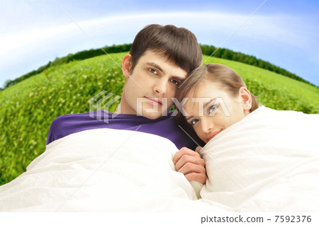 Young man and woman in bed. Couple. Young man and woman in bed. Couple. 7592376