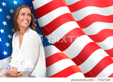 Portrait of pretty young woman holding book in her arms. USA Fla 7592506