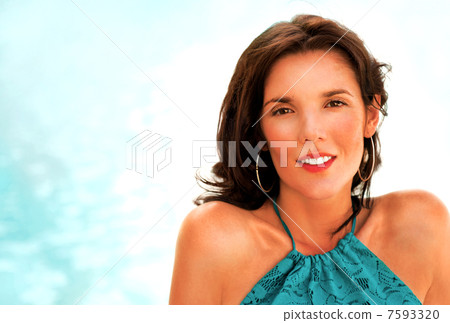 Pretty young woman with hot look and sexy smile sitting near poo 7593320