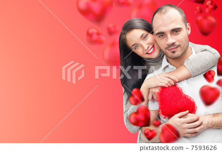 Beautiful young couple embracing and looking at camera. Standing Beautiful young couple embracing and looking at camera. Standing 7593626