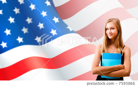 Portrait of pretty young woman holding book in her arms. USA Fla 7593868