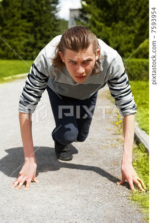 Businessman getting ready for race 7593954