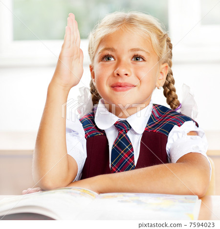Image of smart child reading interesting book in classroom. Vert Image of smart child reading interesting book in classroom. Vert 7594023