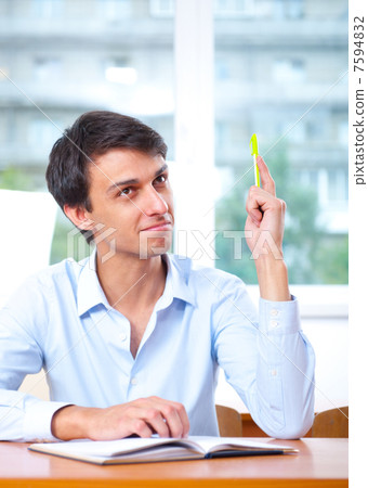 Businessman sitting indoors and writing plan in his diary Businessman sitting indoors and writing plan in his diary 7594832