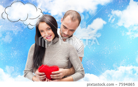 Happy young adult couple with red heart on romantic background w Happy young adult couple with red heart on romantic background w 7594865