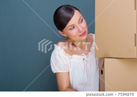 Closeup portrait of a young woman with boxes Closeup portrait of a young woman with boxes 7594870