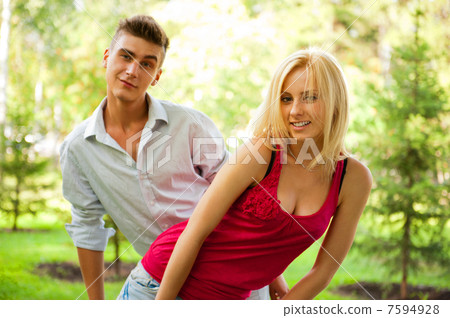 Portrait of young pretty woman and her male gay friend playing t 7594928