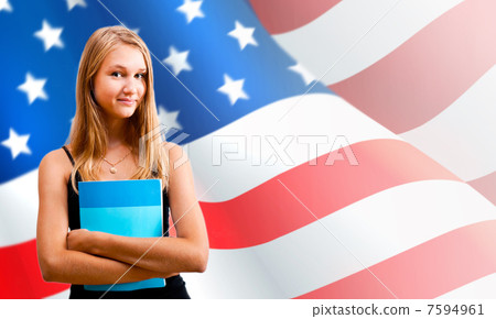 Portrait of pretty young woman holding book in her arms. USA Fla 7594961