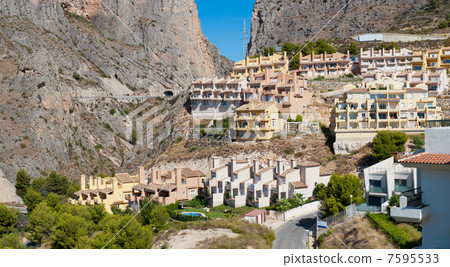 Beautiful house buildings at Spanish landscape. Pueblo Mascarat, 7595533