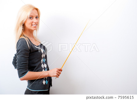 Portrait of young teacher pointing on white marker board in mode Portrait of young teacher pointing on white marker board in mode 7595615