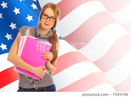 Portrait of pretty young woman holding book in her arms. USA Fla 7595799
